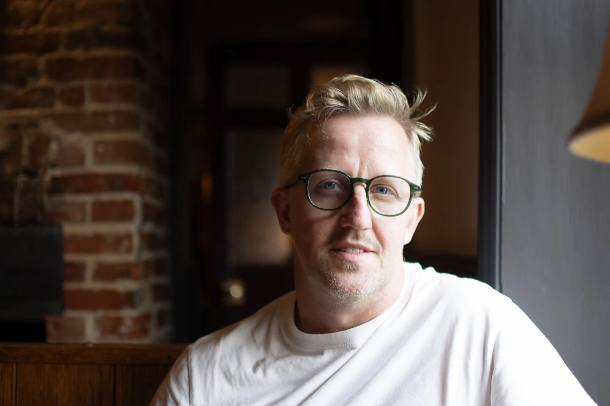 Gareth Hector, photographer and founder of Hector's Eye, in a relaxed indoor portrait