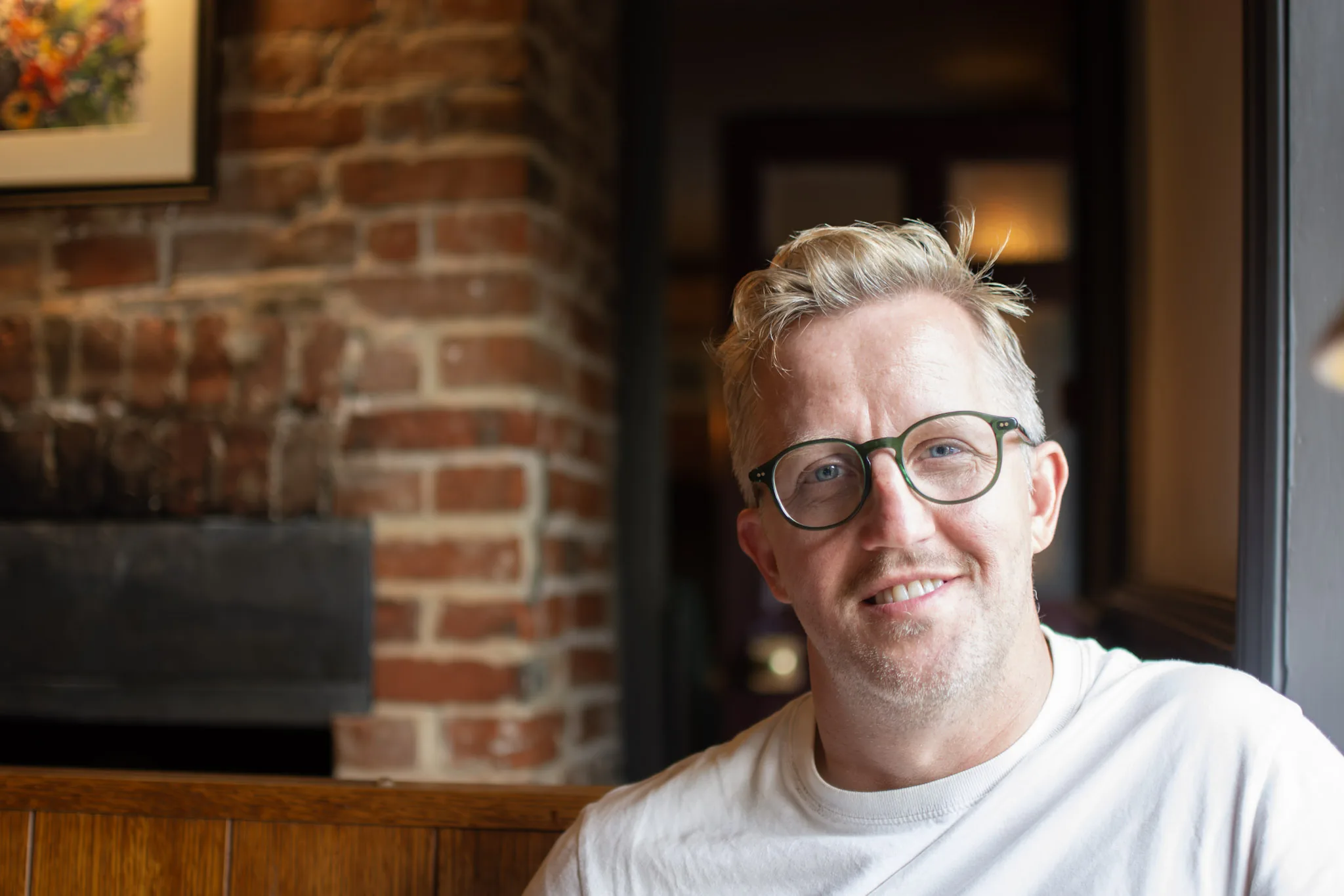 Gareth Hector, photographer and founder of Hector's Eye, smiling in a relaxed indoor portrait