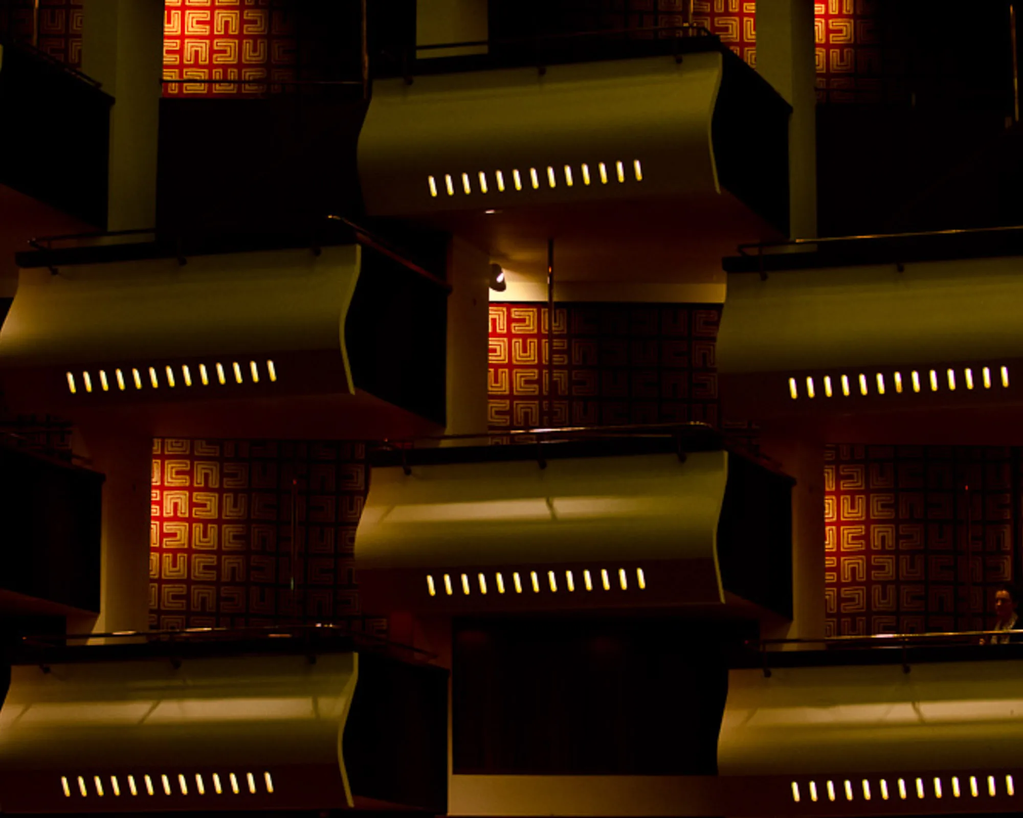 Repeating pattern of hotel balconies and patterned wall panels