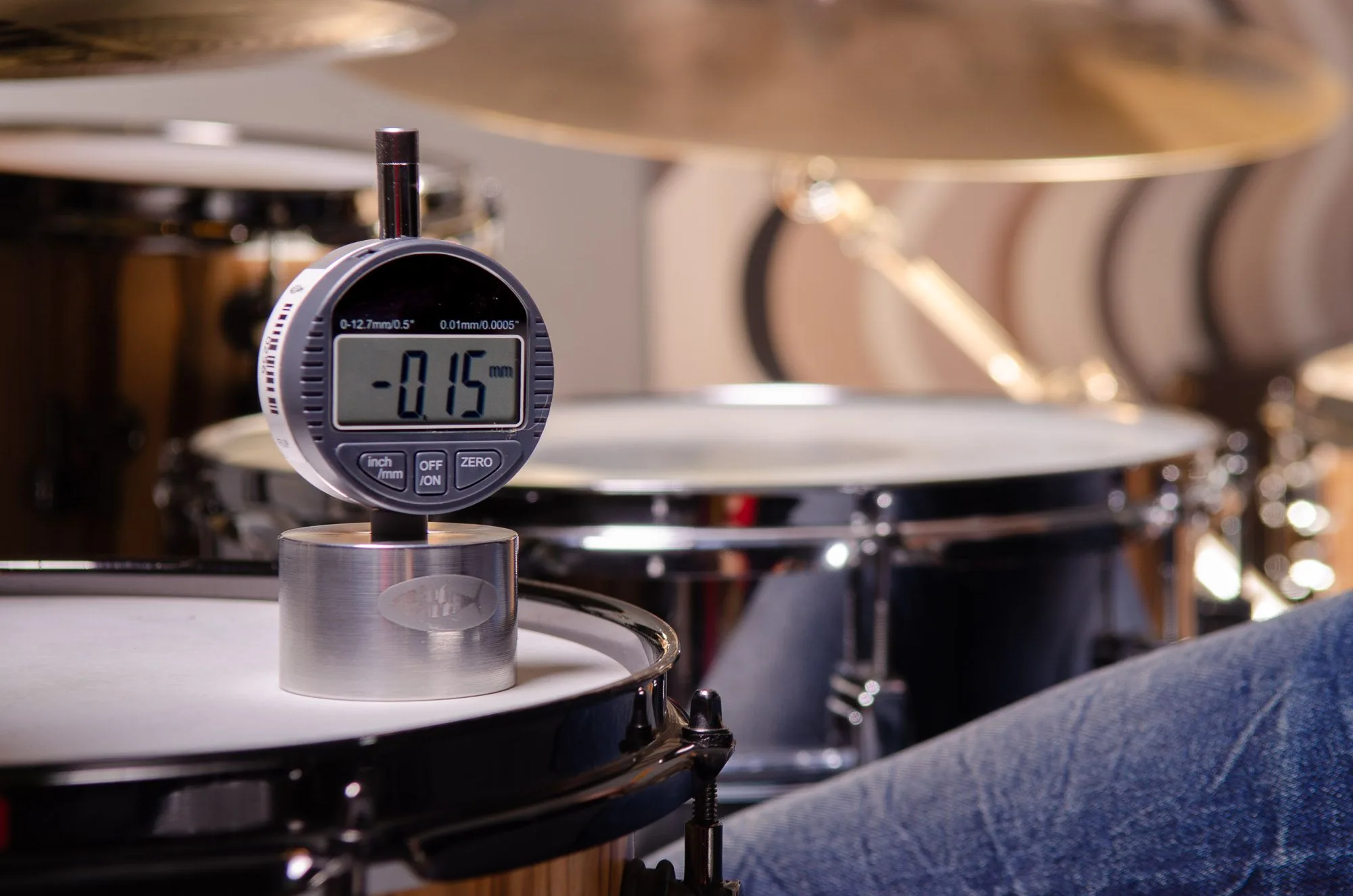 Close-up product shot of a metronome mounted on a snare drum, music equipment brand photography by Hector's Eye