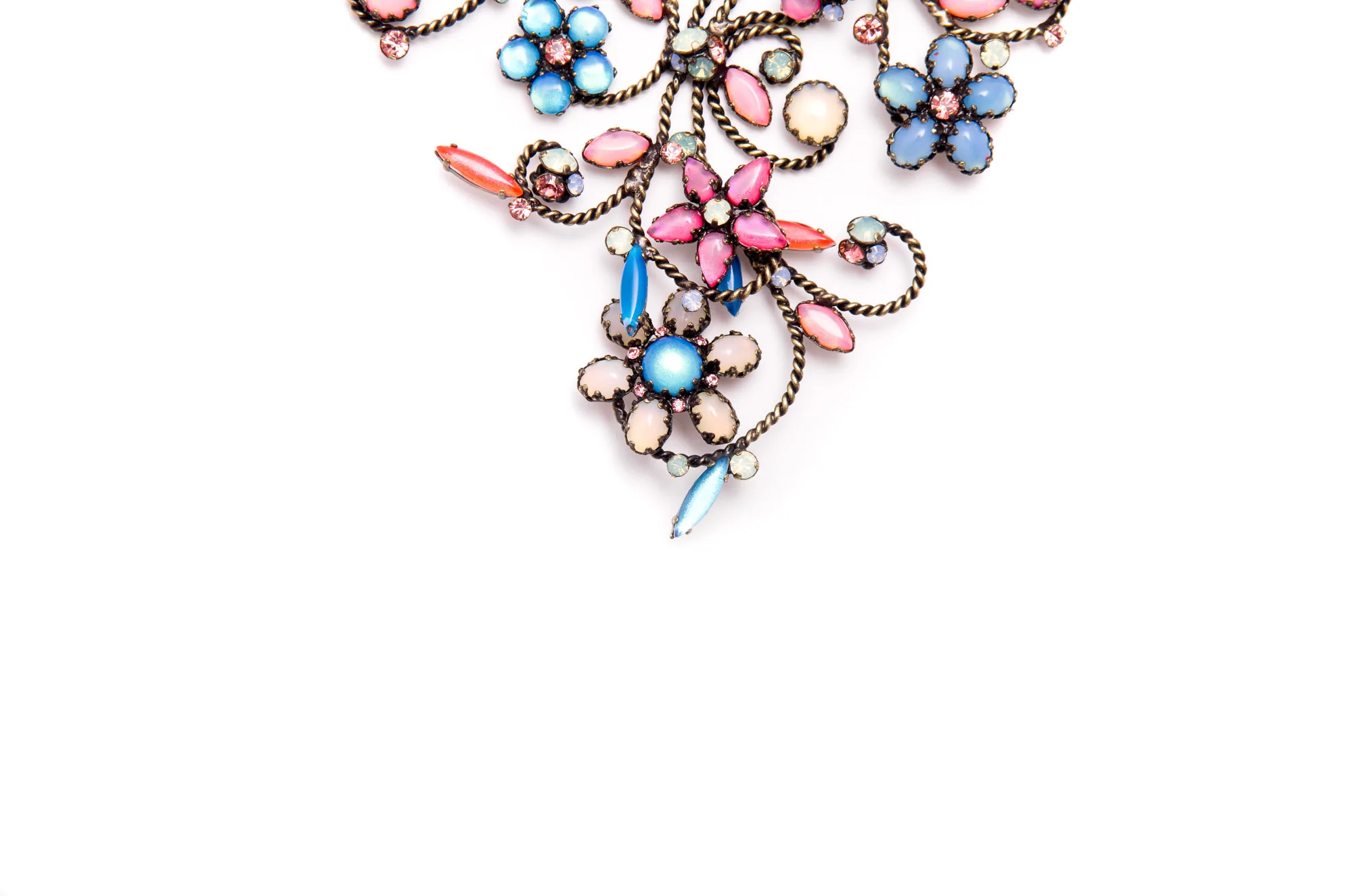 Close-up of an ornate vintage jewelled brooch, product photography by Hector's Eye